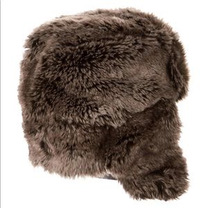 Faux fur hat with leather ties